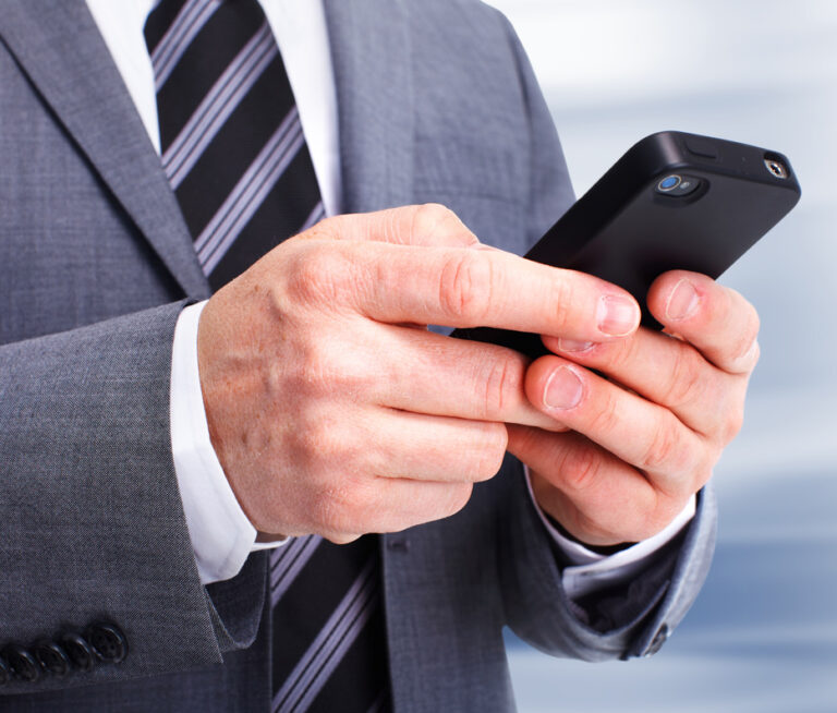 Businessman on a phone call seeking BQPM consulting assistance.